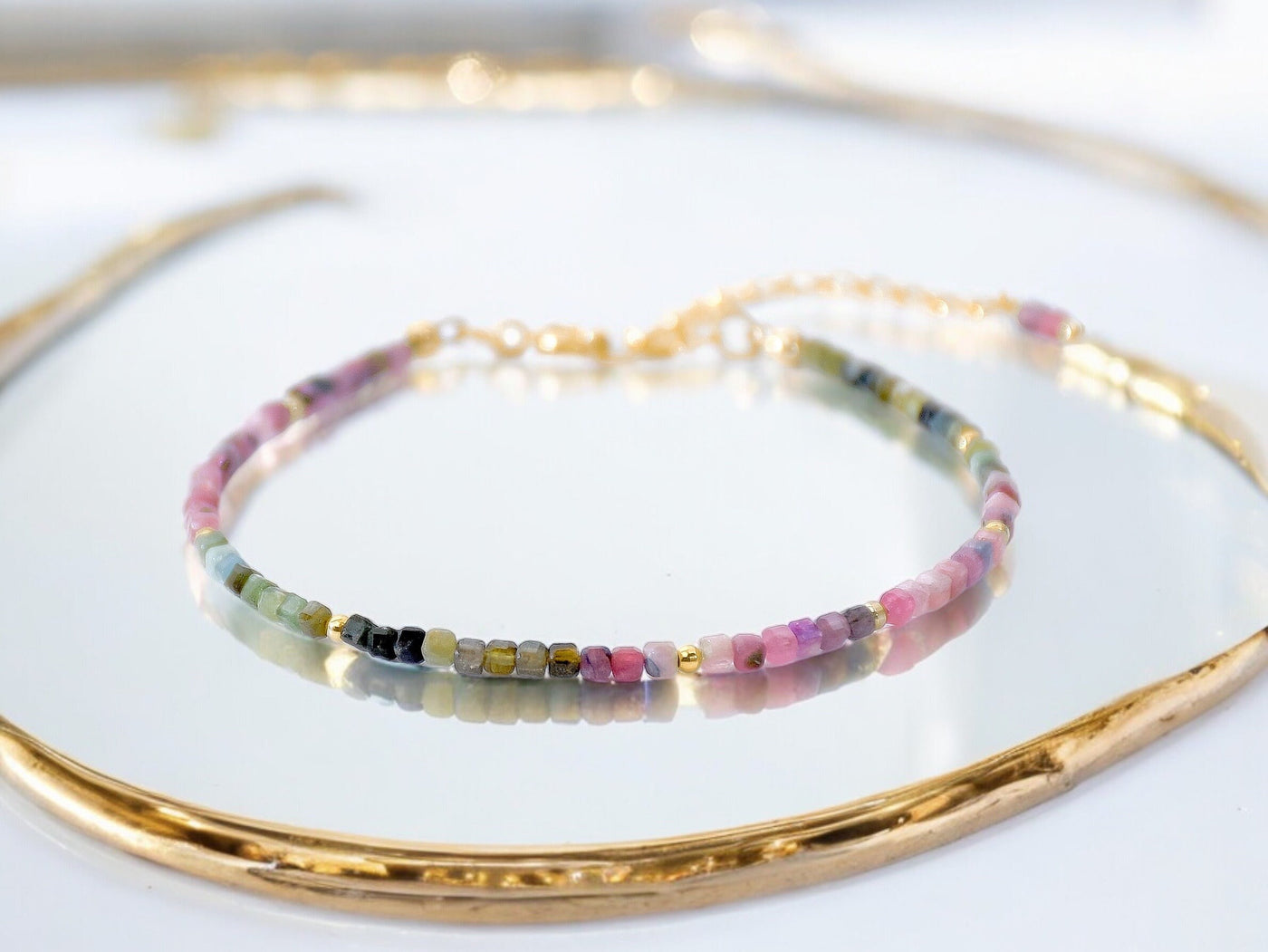 Dainty, lightweight bracelet made from tiny natural, genuine colorful Tourmaline beads in an ombre design. It is gold filled and luxury quality. Handmade jewelry. Perfect gift. Layer with other bracelets as a bracelet stack. Rare & unique