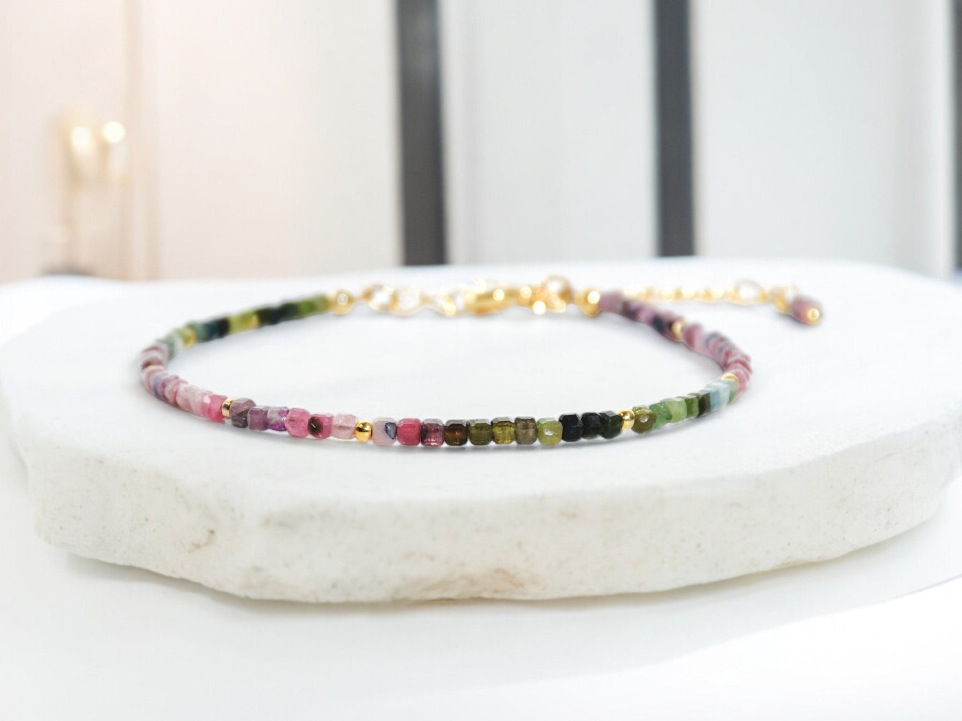 Dainty, lightweight bracelet made from tiny natural, genuine colorful Tourmaline beads in an ombre design. It is gold filled and luxury quality. Handmade jewelry. Perfect gift. Layer with other bracelets as a bracelet stack. Rare & unique