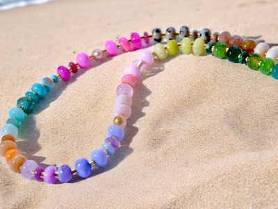 This multi gemstone necklace is handmade, featuring an array of vibrant, rainbow gemstones. From rich amethysts and fiery citrines to lush jades and serene chalcedony.