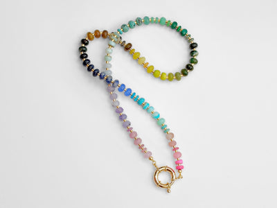 This multi gemstone necklace is handmade, featuring an array of vibrant, rainbow gemstones. From rich amethysts and fiery citrines to lush jades and serene chalcedony.