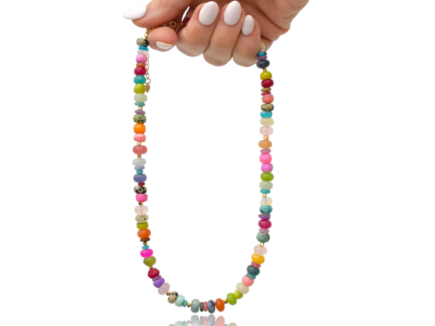 A fun rainbow gemstone necklace in a random assortment. The colors are bright and vibrant. It features 14k gold spacer beads randomly throughout. It&#39;s a beautiful statement necklace to add some color and fun to any outfit. It fits like a choker