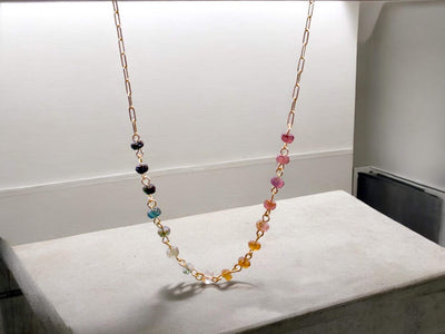 Gorgeous rainbow tourmaline rondelle beaded necklace that is wire wrapped toa 14k gold filled paperclip chain. Handmade and handcrafted natural gems