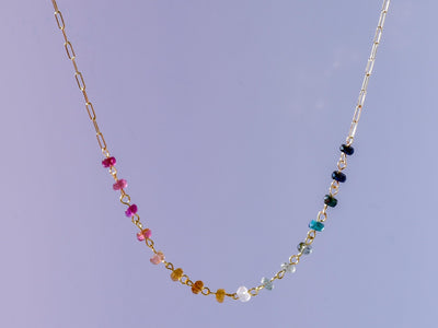 Gorgeous rainbow tourmaline rondelle beaded necklace that is wire wrapped toa 14k gold filled paperclip chain. Handmade and handcrafted natural gems