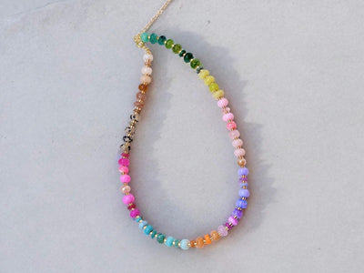 This multi gemstone necklace is handmade, featuring an array of vibrant, rainbow gemstones. From rich amethysts and fiery citrines to lush jades and serene chalcedony.