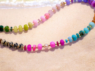 This multi gemstone necklace is handmade, featuring an array of vibrant, rainbow gemstones. From rich amethysts and fiery citrines to lush jades and serene chalcedony.