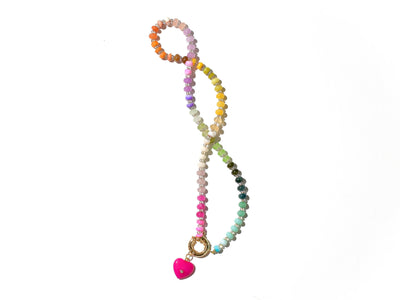 A rainbow multi-gemstone opal necklace that is hand-knotted Made from natural semi precious opal gemstones it features a hot pink heart pendant. It&#39;s feminine & girly w/ a hint of iridescence w/ the added glass shiny beads in between each gemstone.