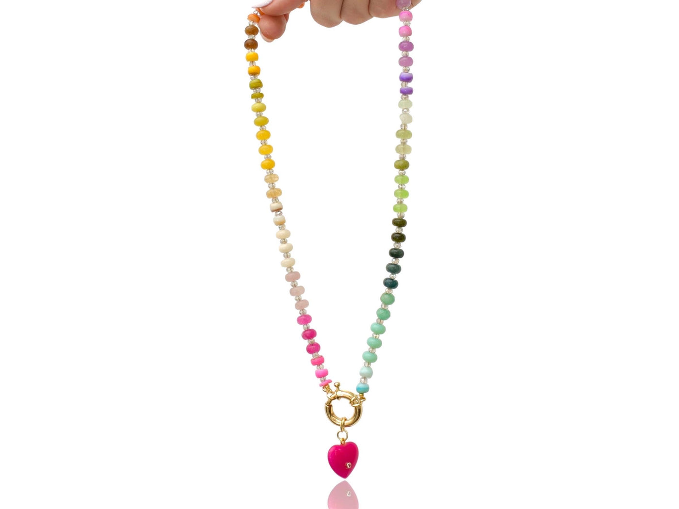 A rainbow multi-gemstone opal necklace that is hand-knotted Made from natural semi precious opal gemstones it features a hot pink heart pendant. It’s feminine & girly w/ a hint of iridescence w/ the added glass shiny beads in between each gemstone.