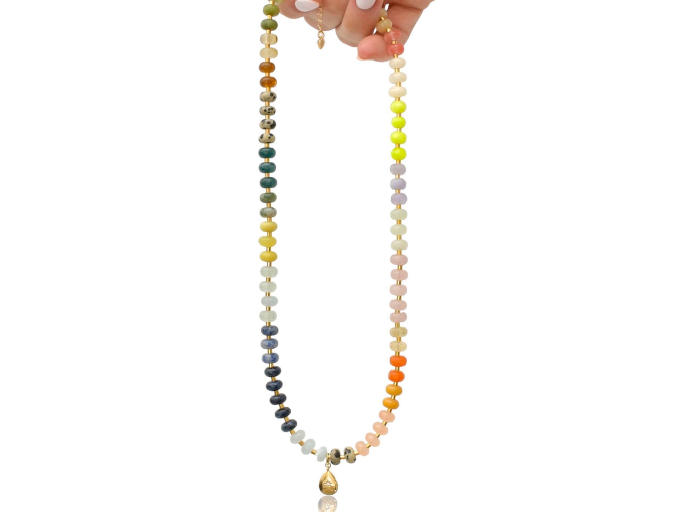 Multi mixed gemstone necklace in earthly jewelry tones. It features gold spacing tube beads that add a hint of shimmer and elegance to the overlook appeal. It has deep oranges, yellows, greens, and browns which tell a vibrant story of a late july.