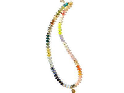 Multi mixed gemstone necklace in earthly jewelry tones. It features gold spacing tube beads that add a hint of shimmer and elegance to the overlook appeal. It has deep oranges, yellows, greens, and browns which tell a vibrant story of a late july.