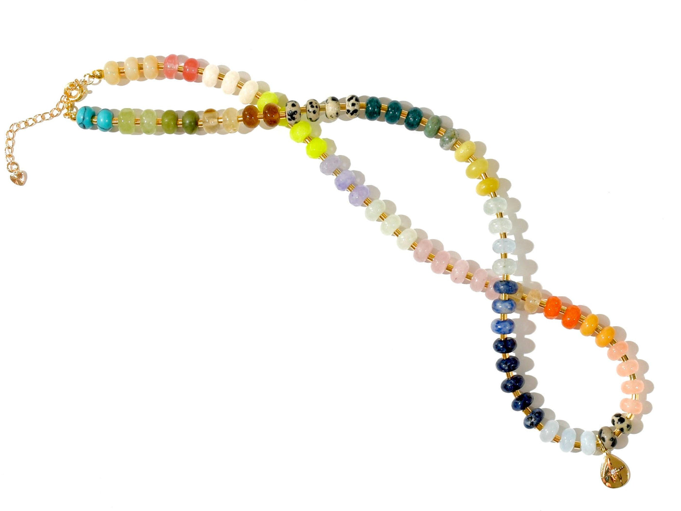 Multi mixed gemstone necklace in earthly jewelry tones. It features gold spacing tube beads that add a hint of shimmer and elegance to the overlook appeal. It has deep oranges, yellows, greens, and browns which tell a vibrant story of a late july.