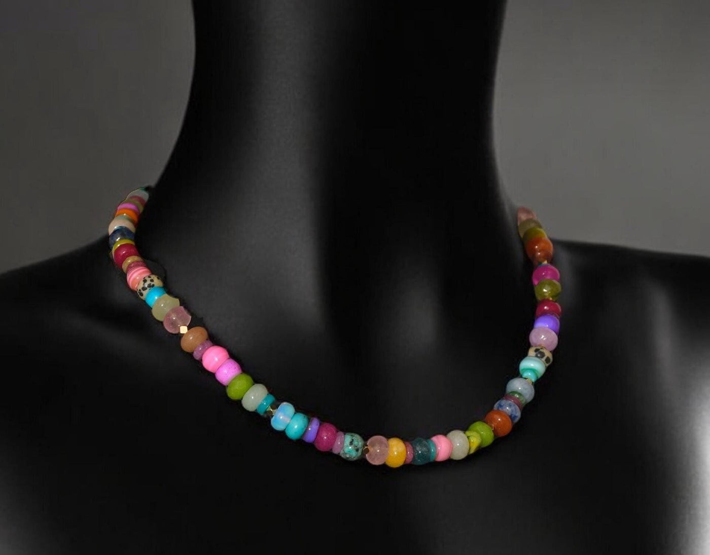 A fun rainbow gemstone necklace in a random assortment. The colors are bright and vibrant. It features 14k gold spacer beads randomly throughout. It’s a beautiful statement necklace to add some color and fun to any outfit. It fits like a choker