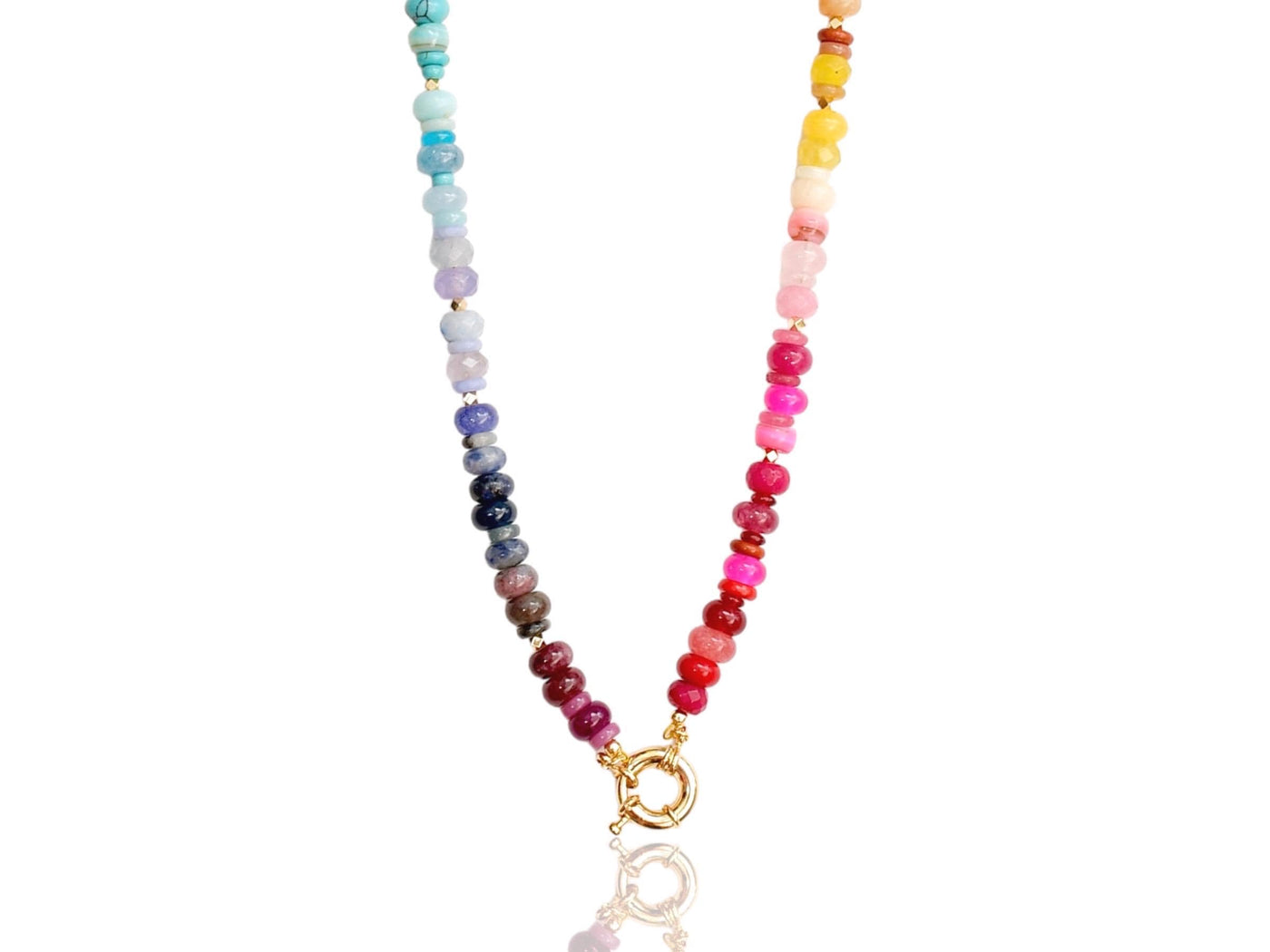 Multi mixed gemstone necklace in bright, jeweled colors . It features gold spacing tube beads that add a hint of shimmer and elegance to the overlook appeal.