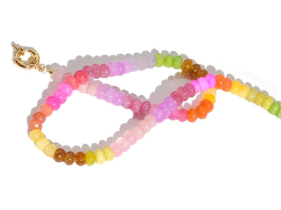 A Candy Colored Long Beaded Gem Necklace featuring amethysts, jades, rose quartz and opal rainbow beads. It is a beautiful Boho Chic Statement Necklace for the Summer in colors of bright neon pinks , purples, oranges, greens and yellows.