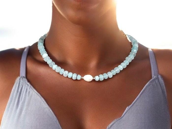 Light blue aquamarine Gem Necklace hand made with silver and gold spacer beads. It is a beautiful Boho Chic Statement Necklace for the Summer in colors of soft blue.