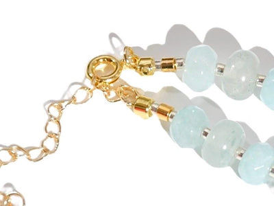 Light blue aquamarine Gem Necklace hand made with silver and gold spacer beads. It is a beautiful Boho Chic Statement Necklace for the Summer in colors of soft blue.