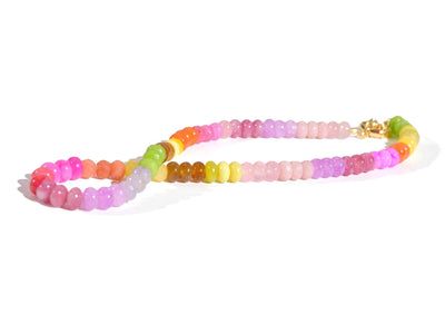 A Candy Colored Long Beaded Gem Necklace featuring amethysts, jades, rose quartz and opal rainbow beads. It is a beautiful Boho Chic Statement Necklace for the Summer in colors of bright neon pinks , purples, oranges, greens and yellows.