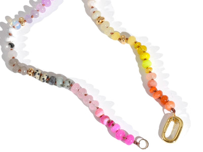 Candy Colored Long Beaded Gem Necklace featuring neon colored rainbow gemstones and opal rainbow beads. It is a beautiful Boho Chic Statement Necklace for the Summer in colors of bright neon pinks , purples, oranges, pastels and yellows.