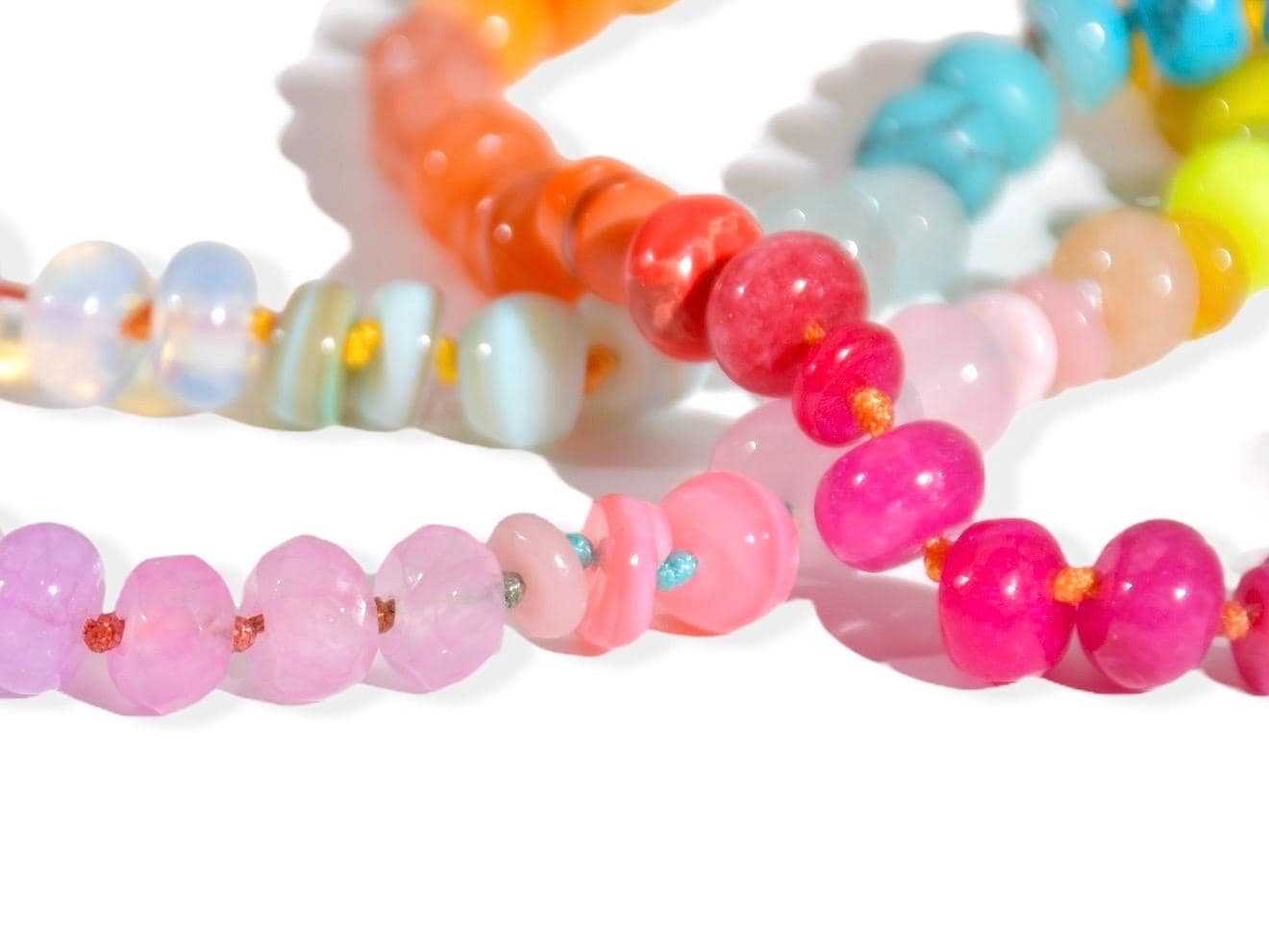 Candy Colored Long Beaded Gem Necklace featuring neon colored rainbow gemstones opal rainbow beads. It is a beautiful Boho Chic Statement Necklace for the Summer in colors of bright neon pinks , purples, oranges, turquoise and yellows.