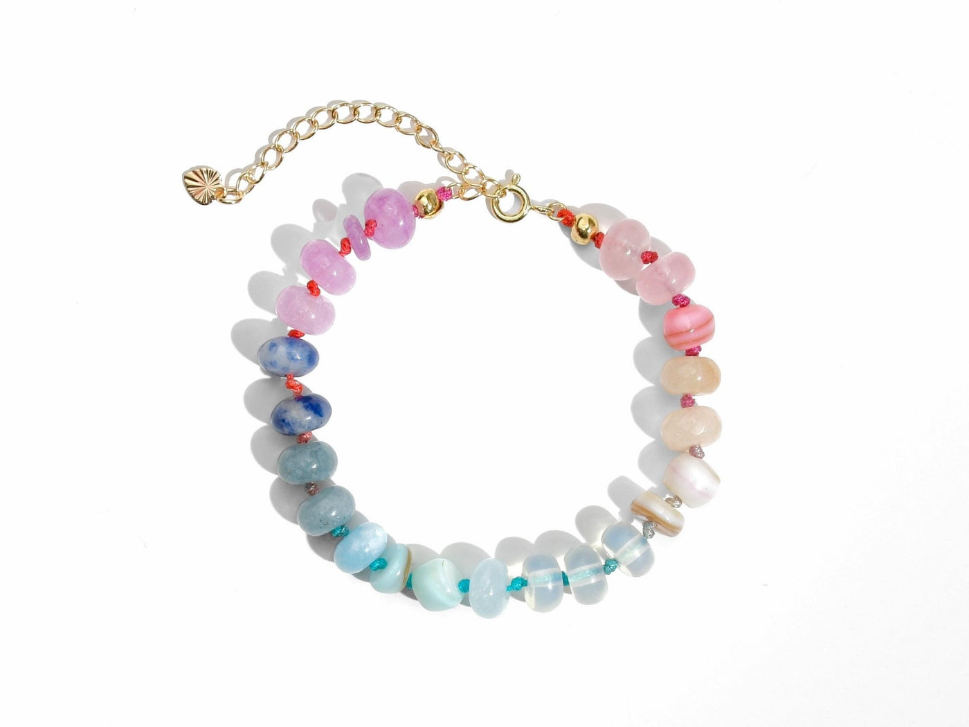 A beautiful pastel colored gemstone hand-knotted bracelet. Hues are rainbow pastels. Natural gemstones hand-knotted with a rainbow ombre thread. It&#39;s perfect to wear alone or stack with other bracelets.