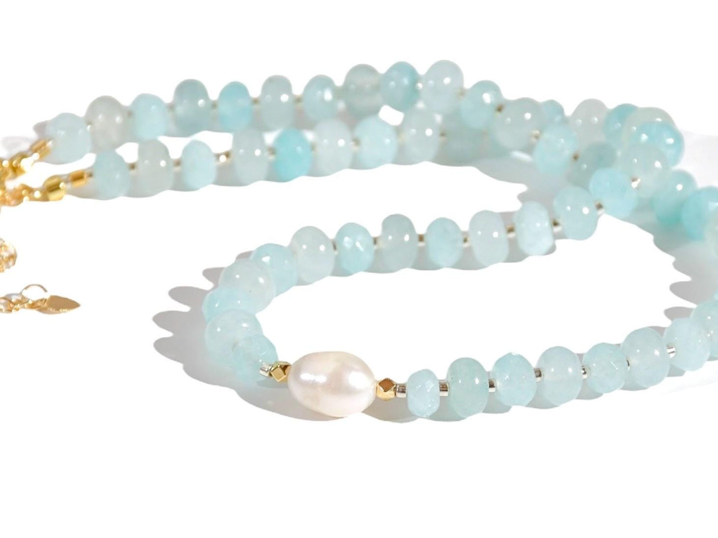 Light blue aquamarine Gem Necklace hand made with silver and gold spacer beads. It is a beautiful Boho Chic Statement Necklace for the Summer in colors of soft blue.